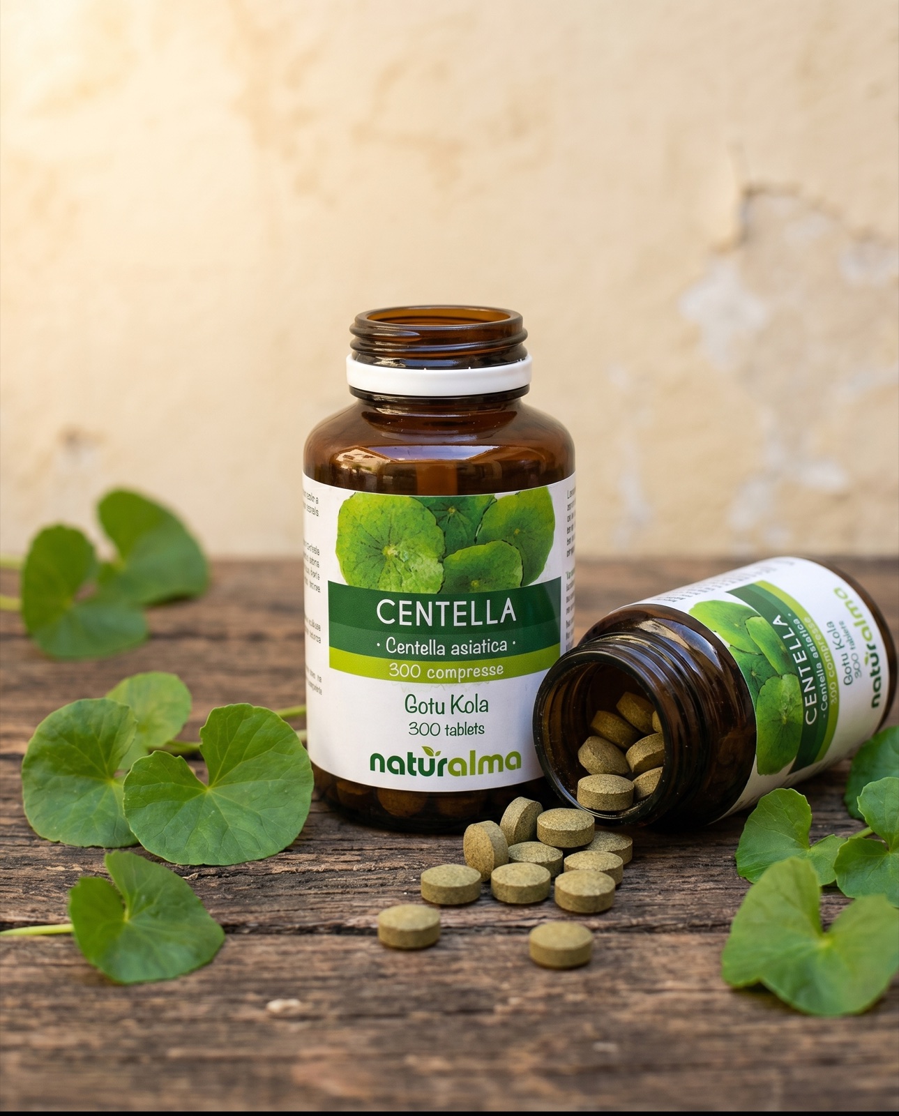 Centella asiatica — tablets pouring out of the Naturalma jar, beside centella leaves